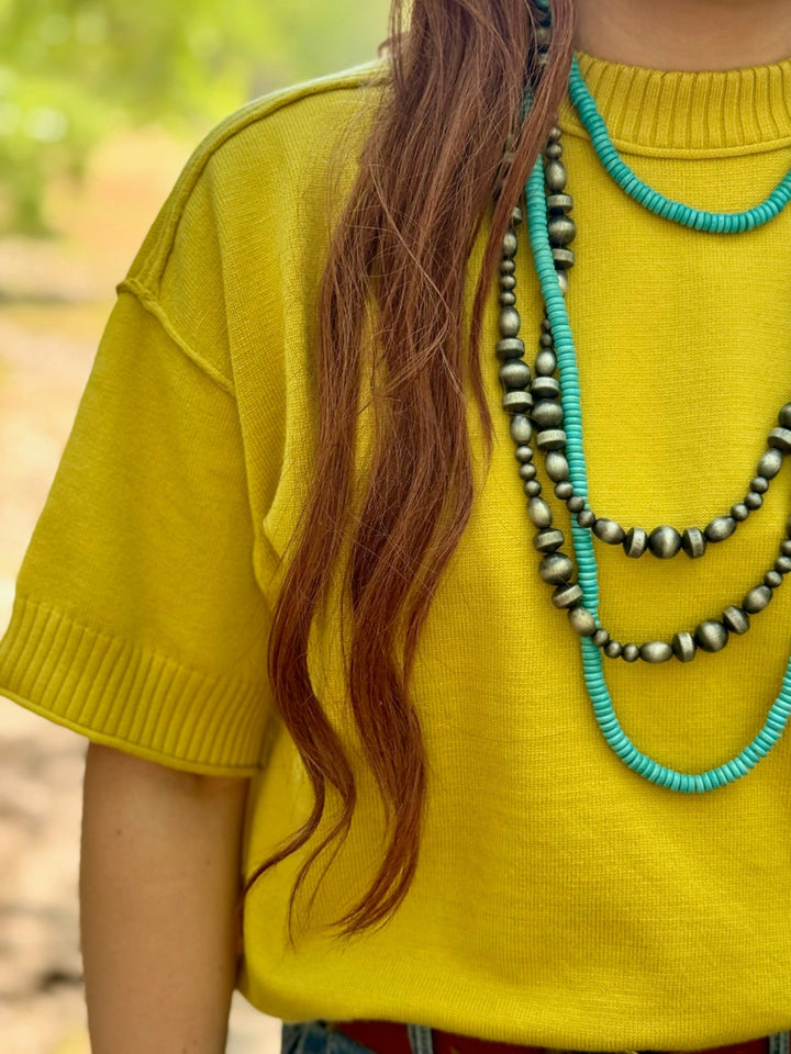 Clara Exposed Hem Top